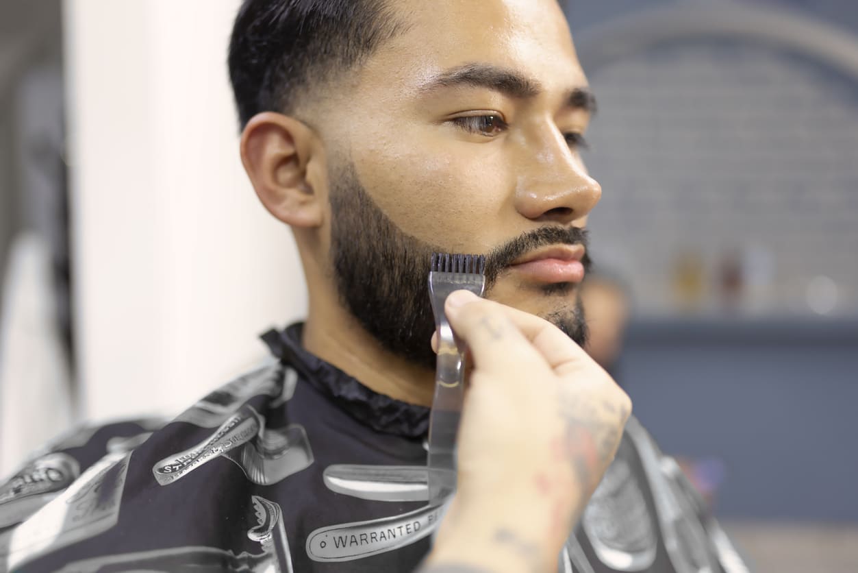 Barbering Student Learning Beard Trimming Techniques